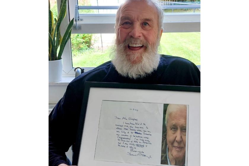 Shep, a resident at Westmead Residential Care Home in Droitwich with a hand-written letter from his hero Sir David Attenborough