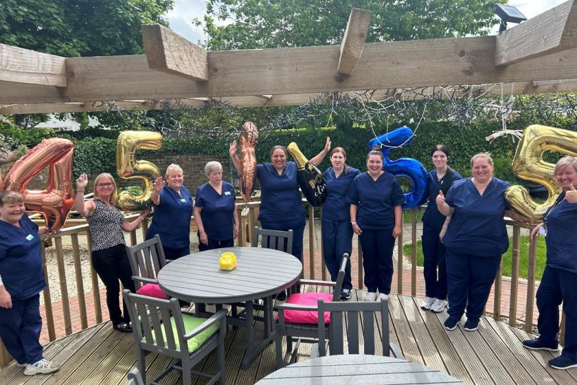 The team at Howard House with balloons to celebrate the home's recent 'Very Good' Care Inspectorate rating 