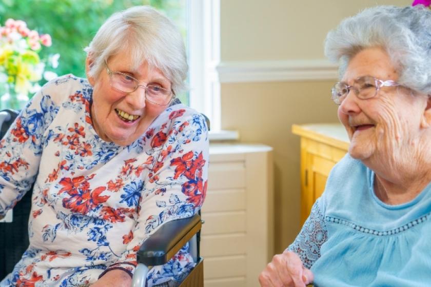 Residents sat down and laughing together at Blackwood Care Home