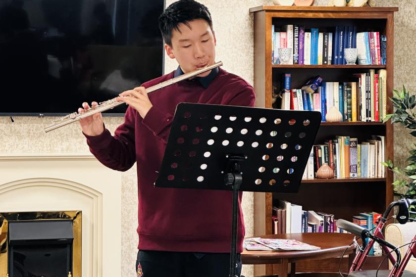 Volunteer playing Flute 