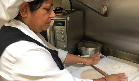 Hansa Bagtharia, chef at Asra House Residential Care Home, preparing chapattis. Hansa Bagtharia prepares chapattis