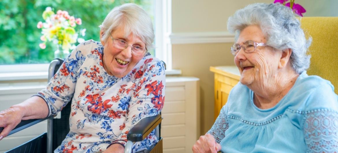 Residents sat down and laughing together at Blackwood Care Home