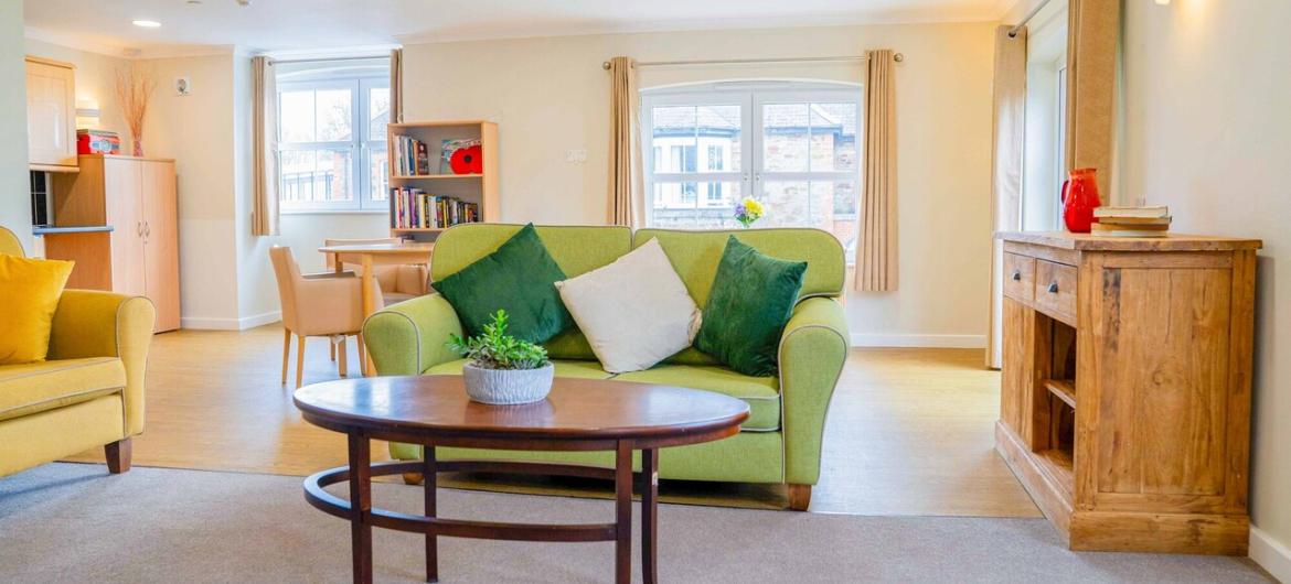 The Trevern, seating area A bright, cosy lounge with comfy seating, natural light, and a homely feel designed for comfort, relaxation, and community.