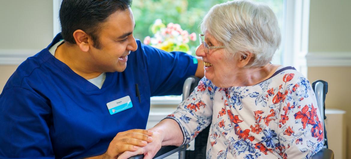 Resident and Carer smiling together