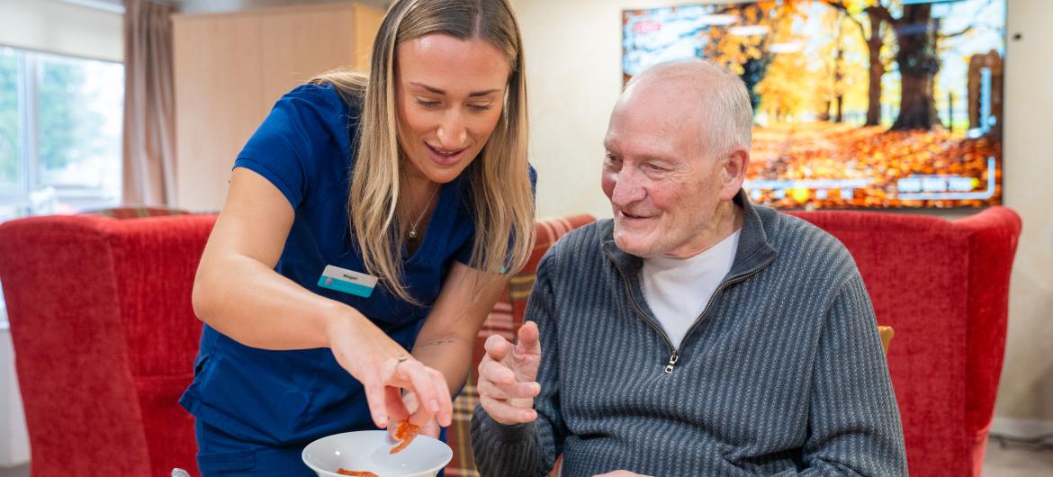 Staff and resident smiling