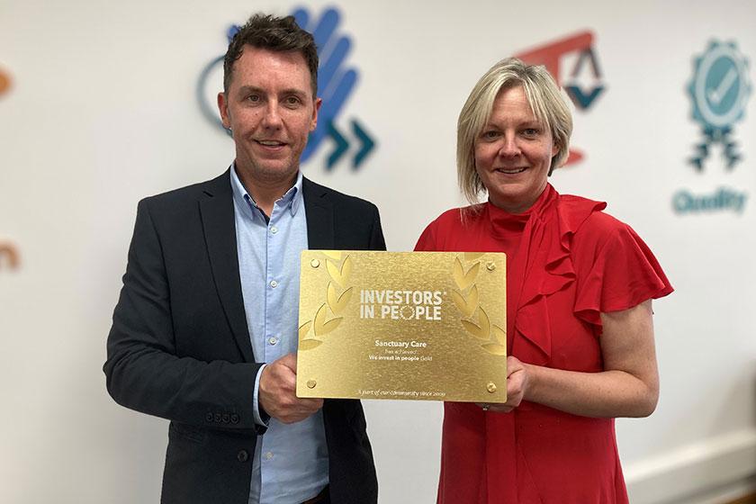 Sanctuary Care's IiP success Neil Quinn and Sarah Clarke-Kuehn with Sanctuary Care's Investors in People Award