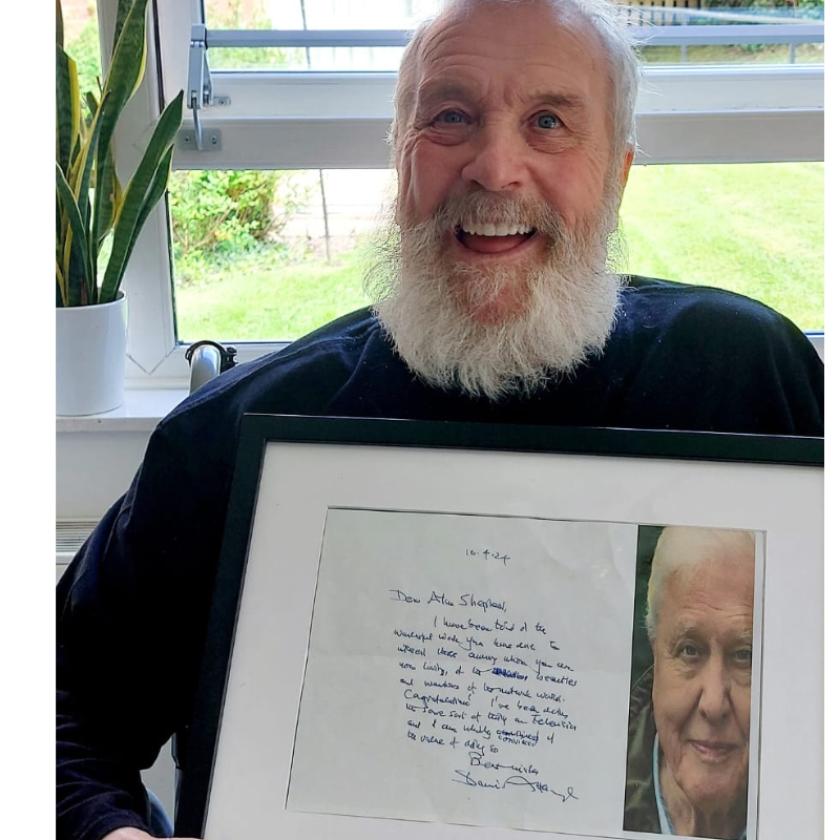 Shep, a resident at Westmead Residential Care Home in Droitwich with a hand-written letter from his hero Sir David Attenborough