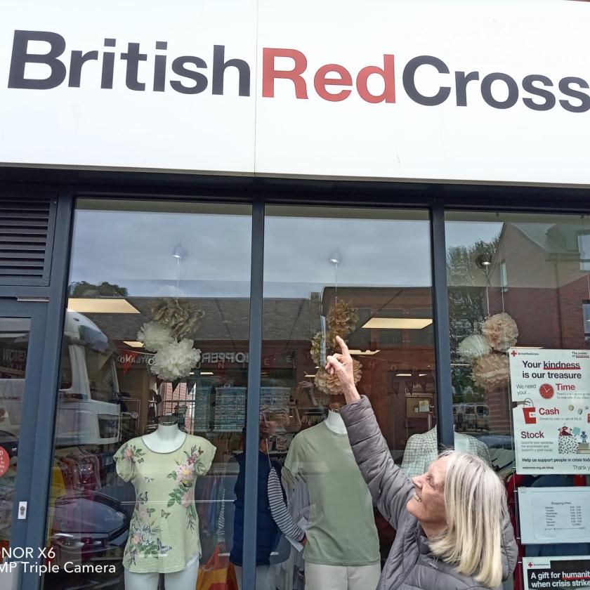 Ann Duffy, a resident at Queens Care Home in Prestwick, outside the charity shop she is volunteering at 