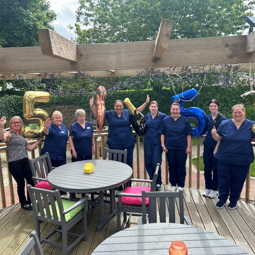 The team at Howard House with balloons to celebrate the home's recent 'Very Good' Care Inspectorate rating 