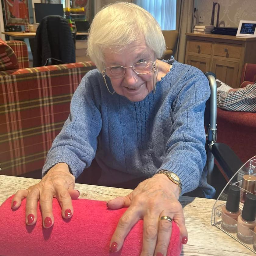 Pat enjoying paper time at Upton Dene