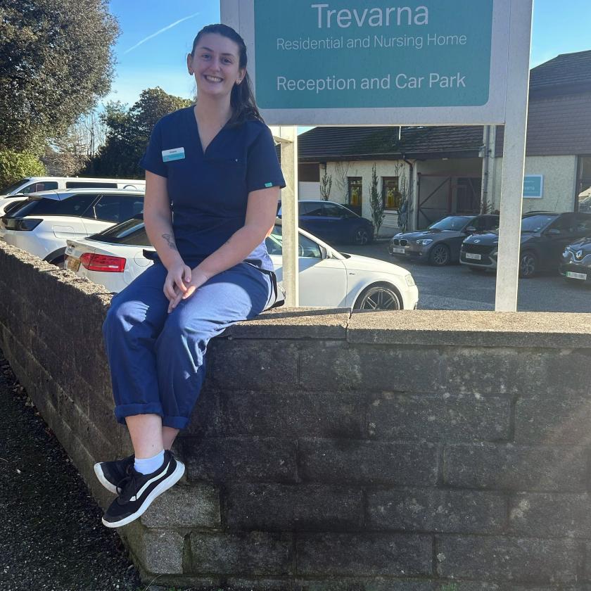 Sanctuary Care Volunteer Sat on Wall