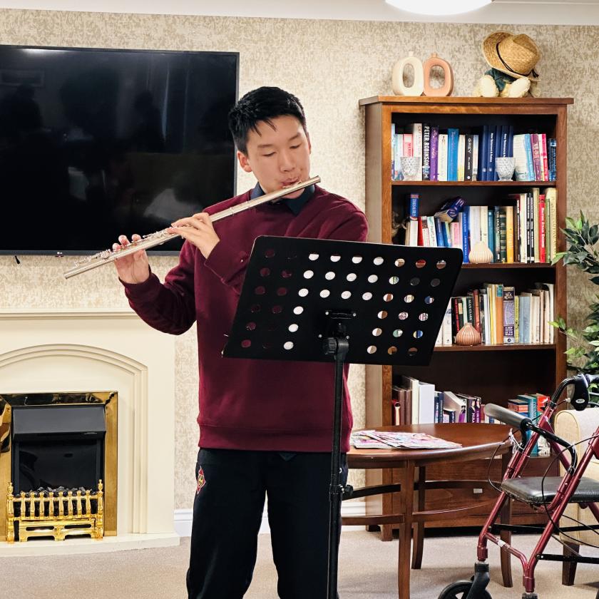 Volunteer playing Flute 