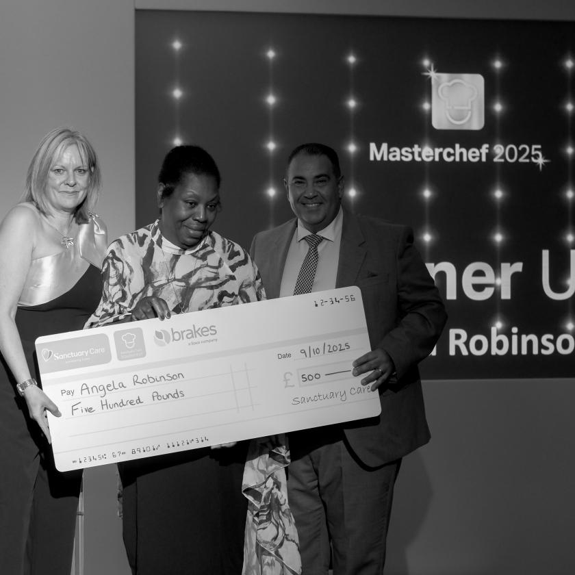 Staff stood together smiling